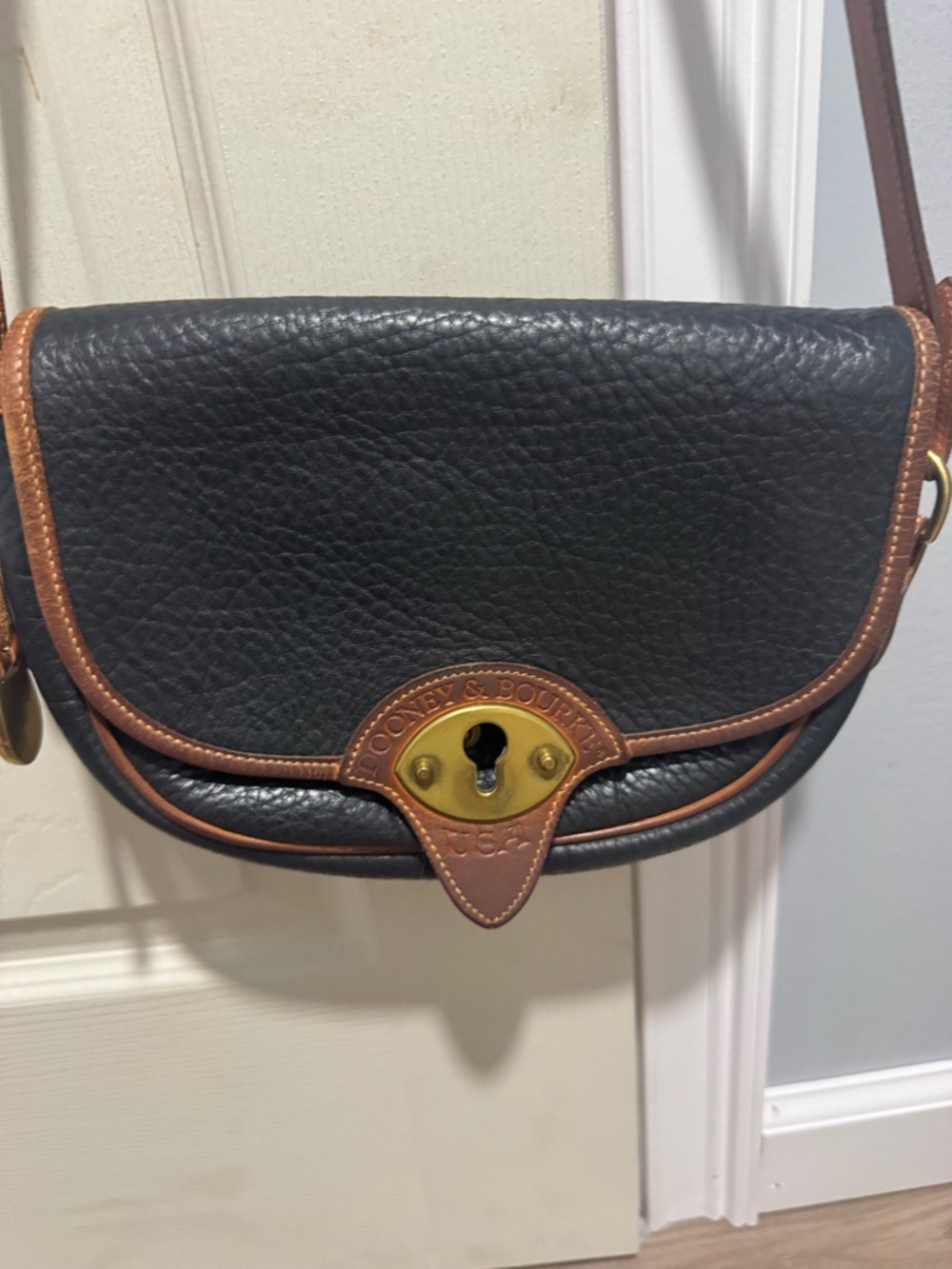Dooney & Bourke Black Pebble Leather Crossbody Bag with Brown Trim